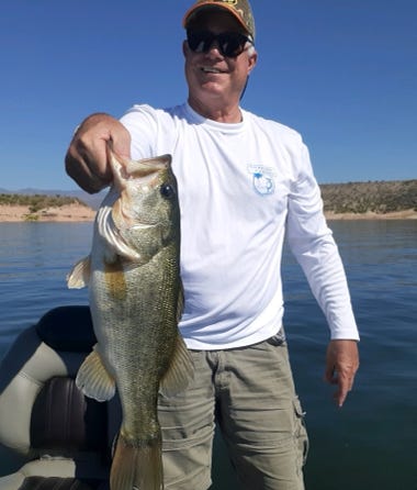 Angler with largemouth bass